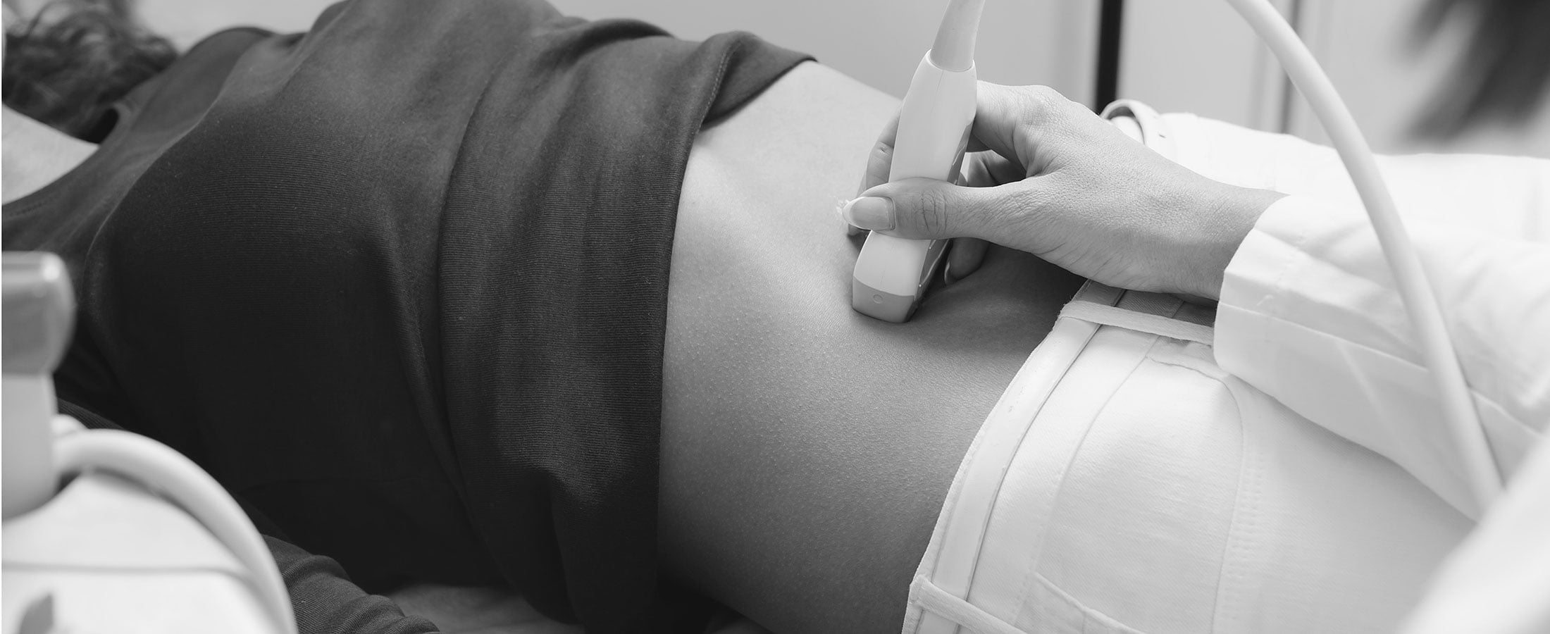 woman getting ultrasound of abdomen